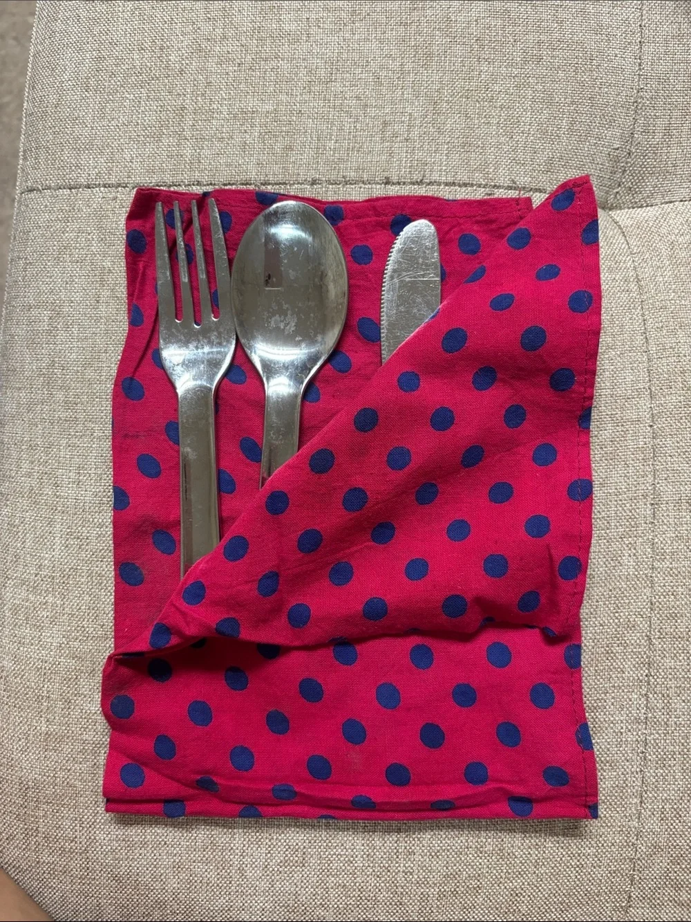 Stainless steel set(fork, spoon, knife) and napkin.